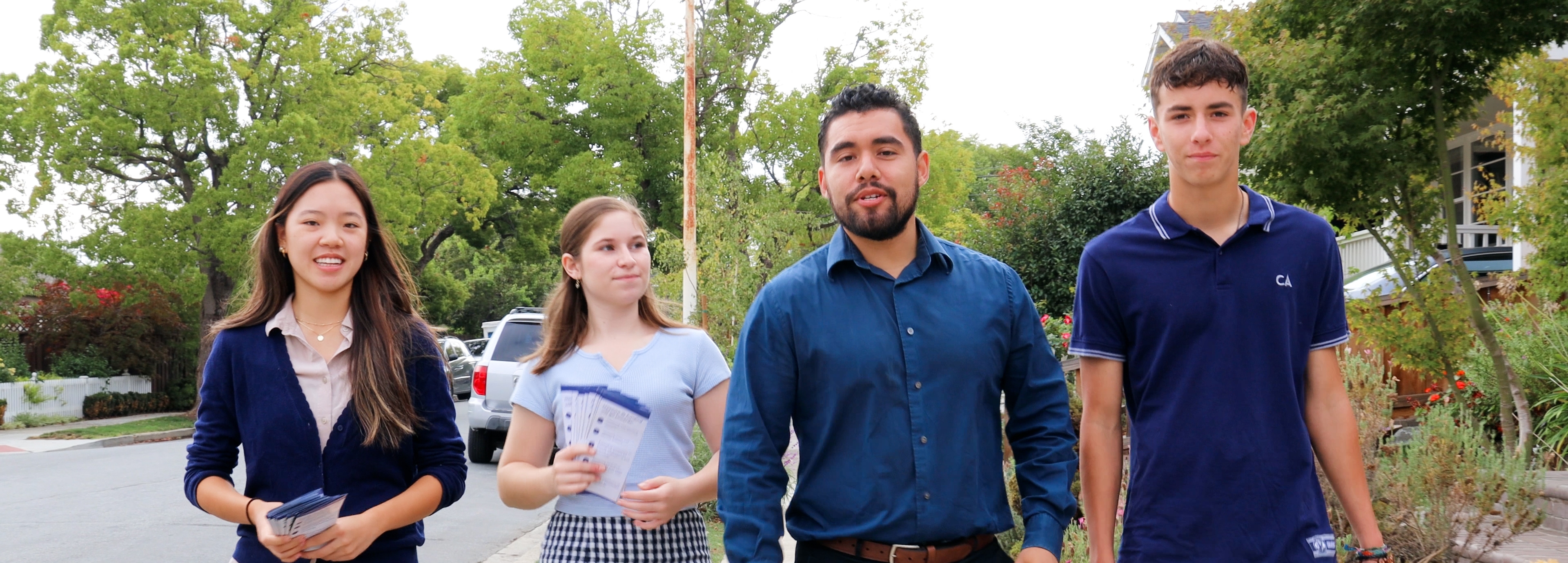 Antonio López walking with campaign volunteers